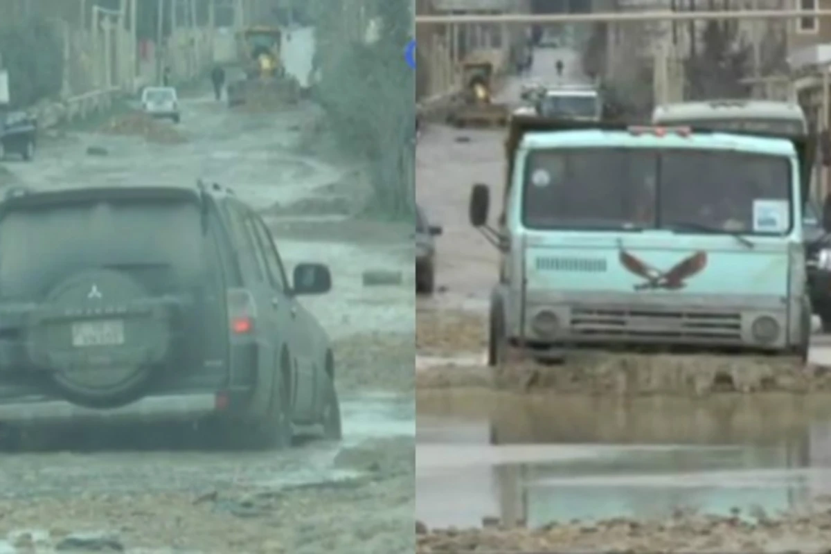 Binəqədinin keçilməz yolları: üzən Kamaz, batan maşın... (VİDEO)