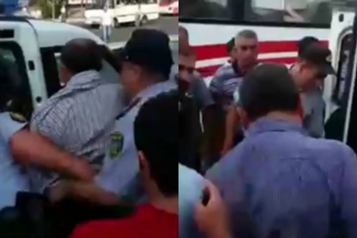 Bakıda 3 polis dilənçini maşına mindirə bilmədi (VİDEO)