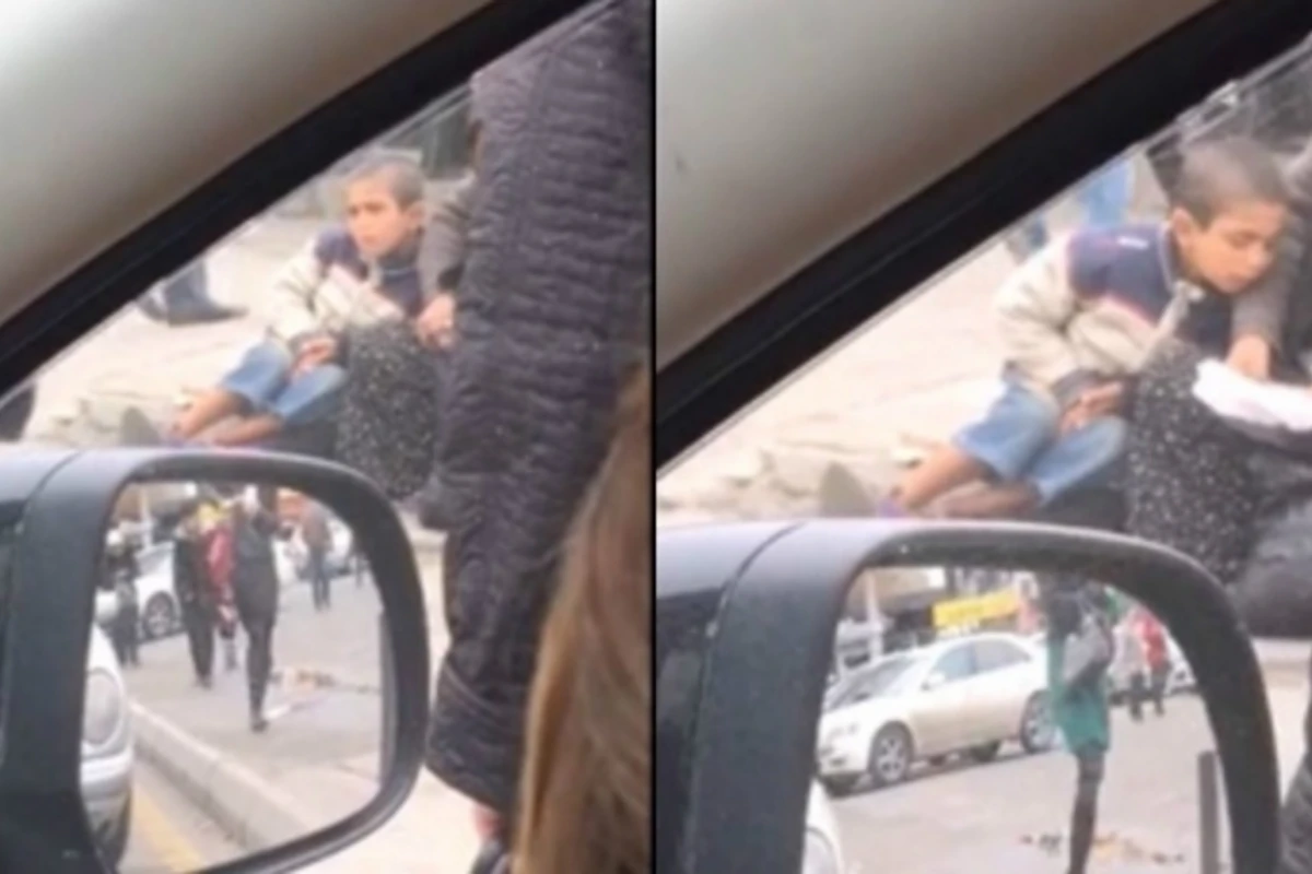 Душераздирающие кадры ребенка-попрошайки в Баку попали на камеру (видео)