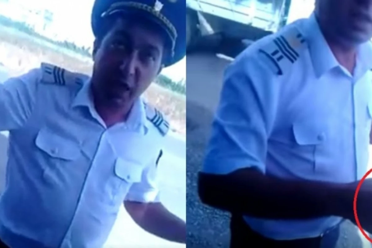 Nəqliyyat işçisi rüşvət alarkən kameraya düşdü: Saxlayan olsa de ki, Musaya vermişəm” (VİDEO)