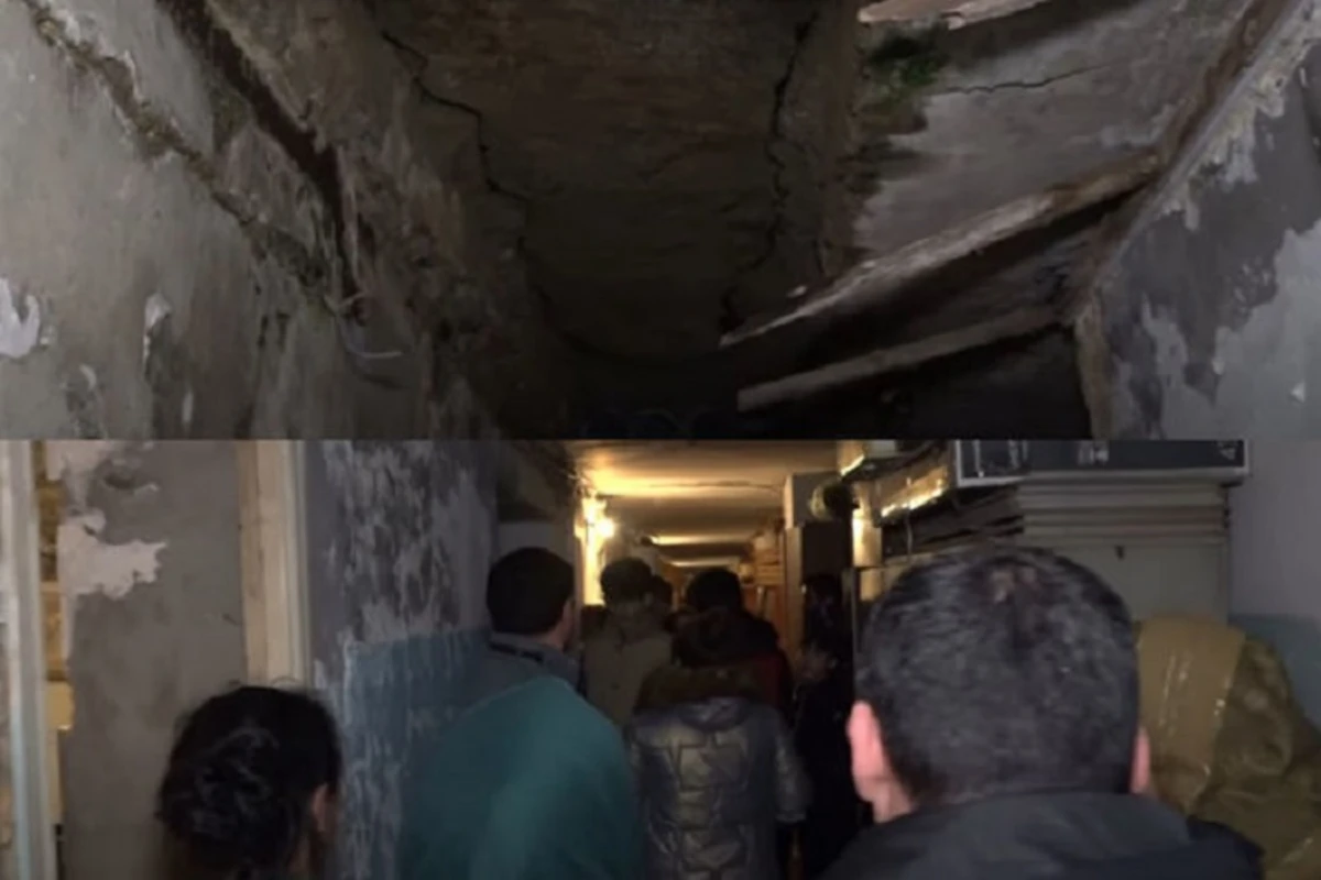 Binəqədidə beton hissələri sökülən binada gərgin anlar yaşandı: Əhali yolu bağladı - VİDEO