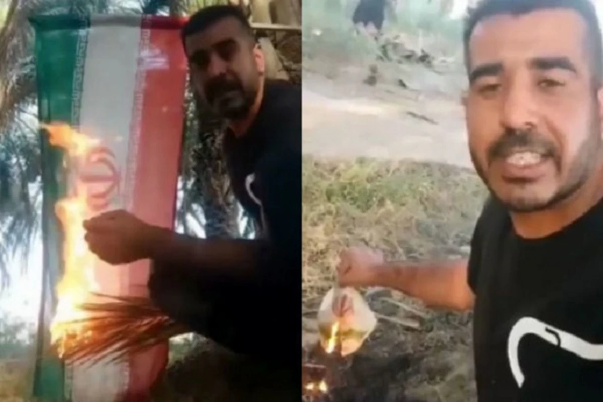 Молодой иранец демонстративно сжег флаг ИРИ - ВИДЕО