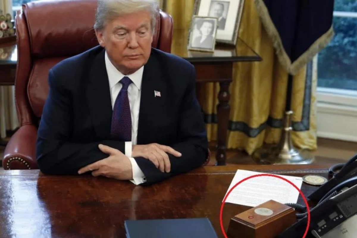 The mystery of Trump's red button in the White House Oval Office has been revealed