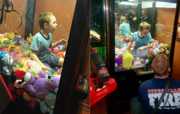 Ребенок застрял в автомате с игрушками (видео)