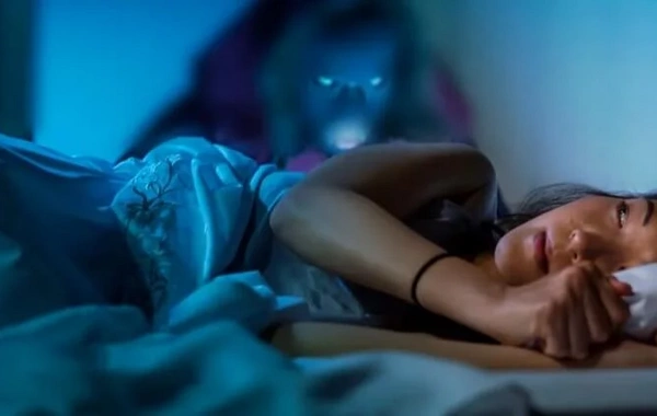 Why do we see deceased relatives in dreams and what does it mean