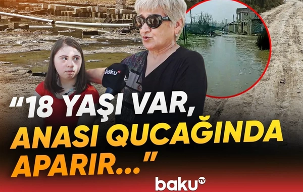 Dəmir yolu küçəsindəki çətinliklər: 18 yaşı var, anası qucağında aparır