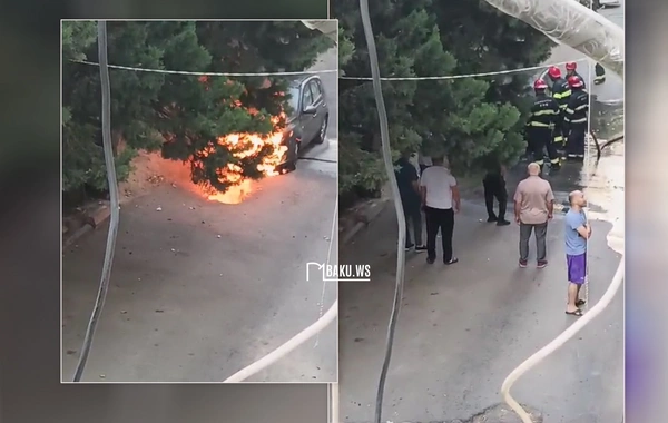 В Баку автомобиль внезапно загорелся на парковке